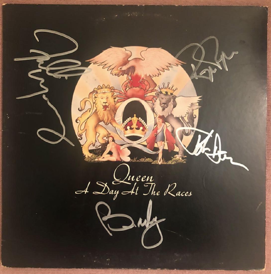 Signed Queen A Day At The Races: Signed by Freddie Mercury, Brian May, Roger Taylor, and John Deacon