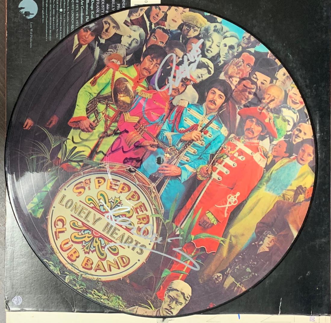 Signed Beatles Sgt. Pepper's Picture Disc: Signed by John Lennon. Paul McCartney, George Harrisson and Ringo Starr