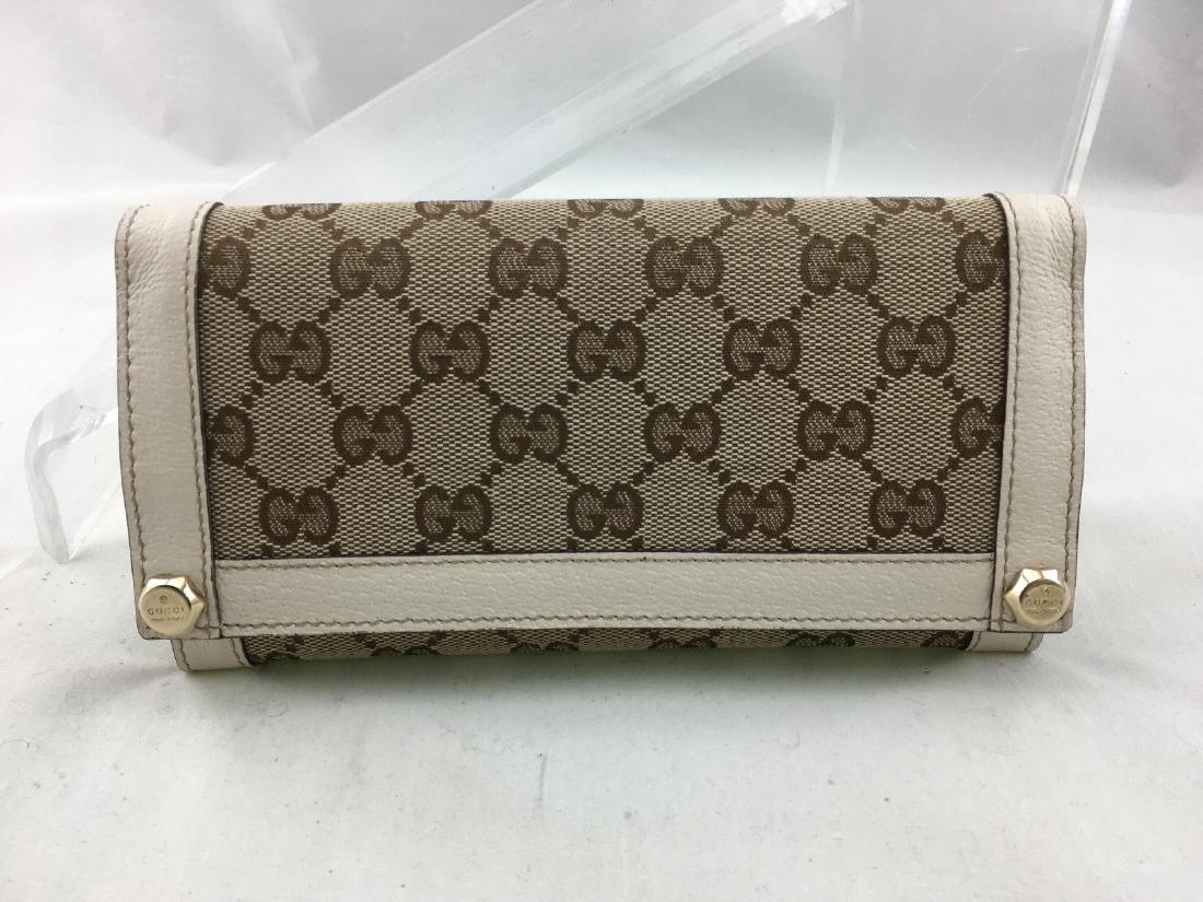 Gucci Signature Envelope Wallet (white leather trim): Brand: Gucci Style:EnvelopeBrand: Color:Beige/ Off White Made in Italy Material:Canvas/ Leather Pattern: Monogram Condition: Very Good/Gently Loved- Some minor wear to the trim 100% authenticity guara