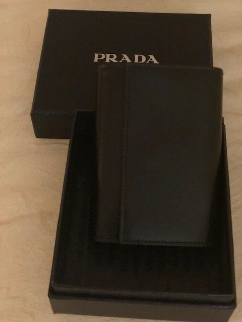 Prada Leather Agenda: Brand: Prada Color: Nero Style: address book/notepad BASIC Materials: 100% calfskin Made in Italy Note: Does not include current calendar