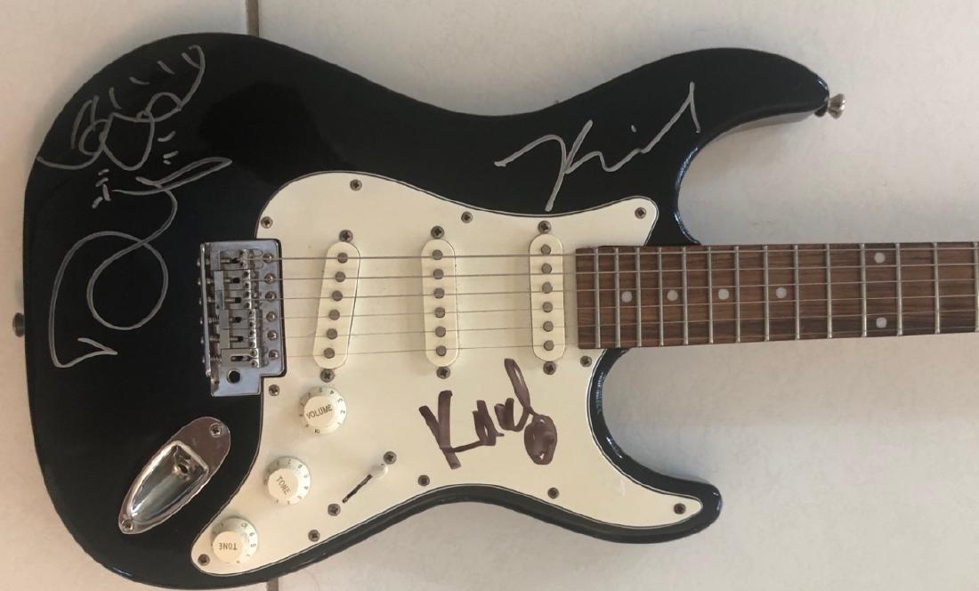Signed AC/DC Guitar with Doodle: Signed by Brian Johnson, Angus Young, Malcolm Young, Cliff Williams, and Phil Rudd