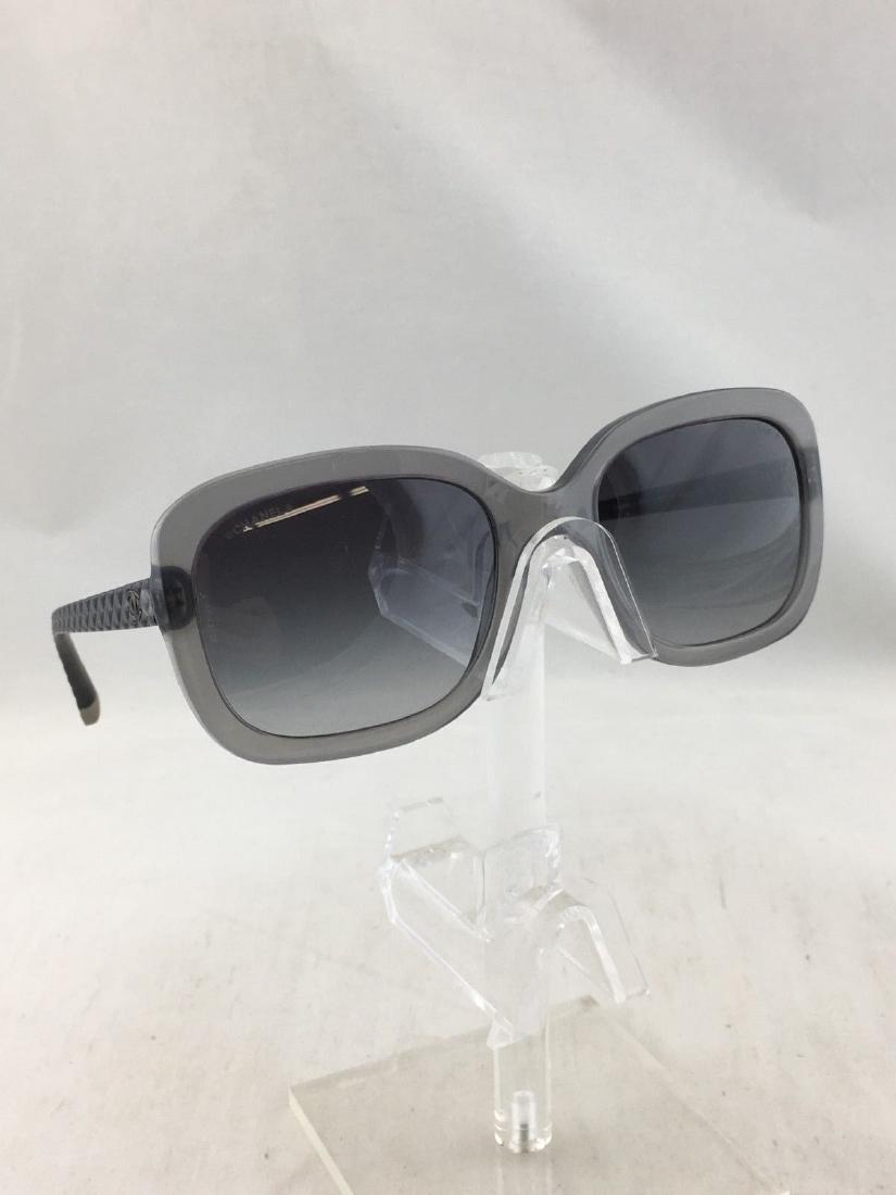 Chanel large sunglasses: Brand: Chanel Square sunglass with quilted style arms Lens/frame color: Gray Plastic Made in Italy CODE aa-5622 Condition: Gently Loved/Very good condition Bid with confidence. 100% authenticity guara