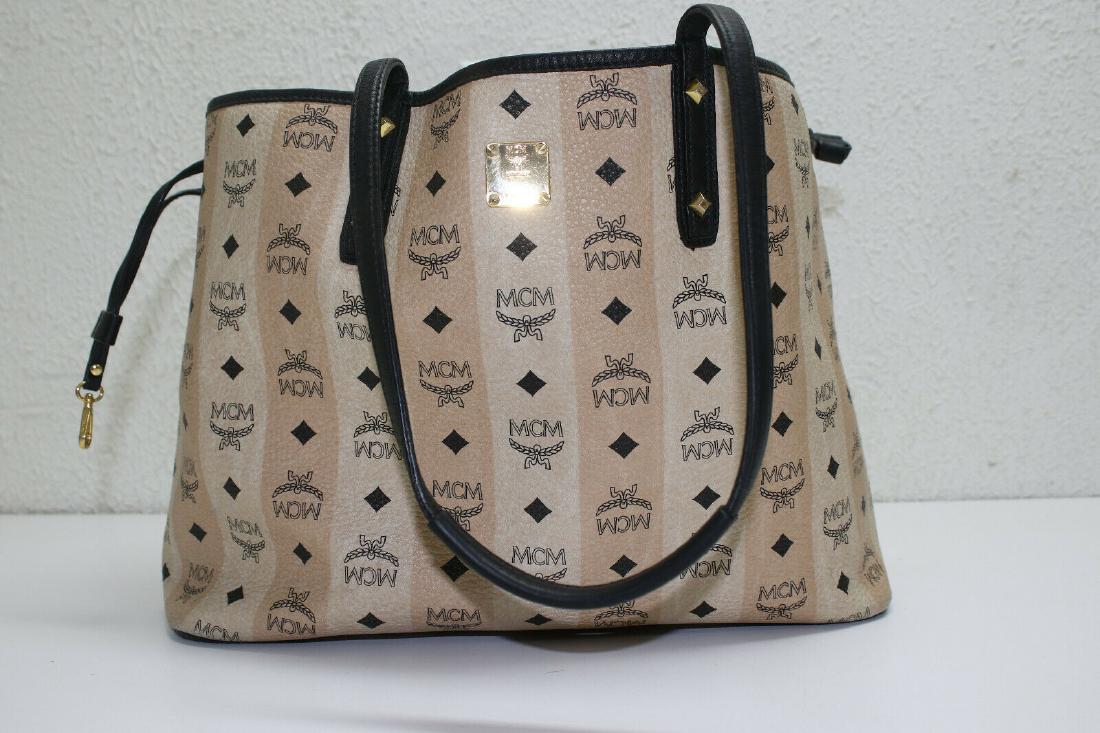 MCM Liz Shopper Tote: MCM Medium Liz Shopper Tote Beige Good condition Slight wear from use Some marks on exterior Scratches on hardware Composition: Coated Canvas with leather trim and gold tone hardware Dimensions: Shoul