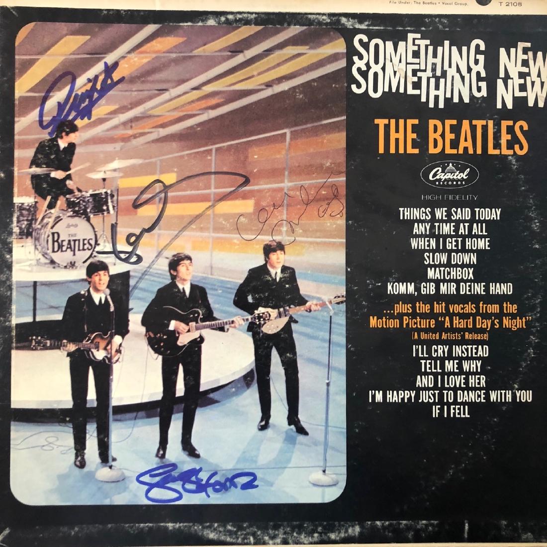 Signed Beatles Something New Album: Signed by John Lennon. Paul McCartney, George Harrisson and Ringo Starr