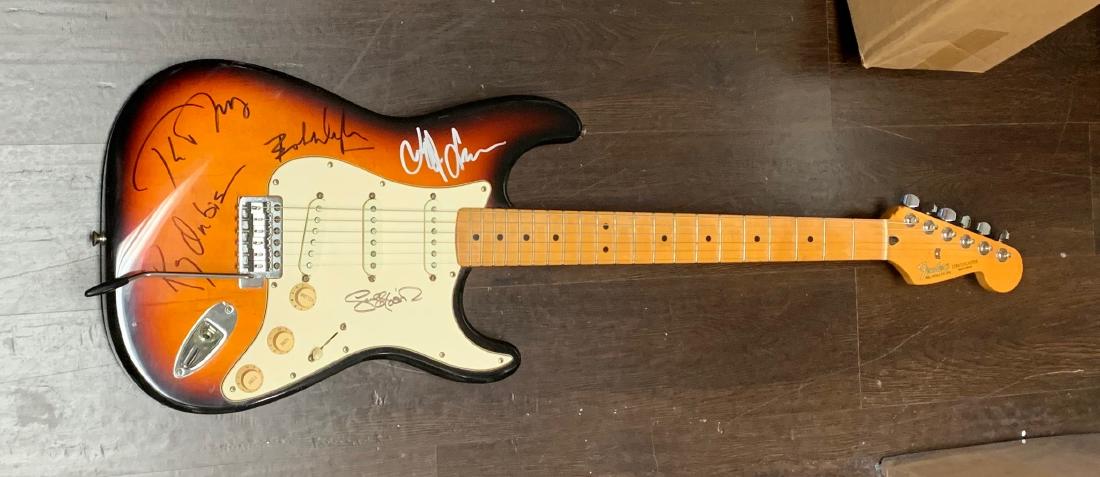 Signed Traveling Wilburys Sunburst Guitar: Signed by Tom Petty, Roy Orbison, Bob Dylan, George Harrison. Jeff Lynne