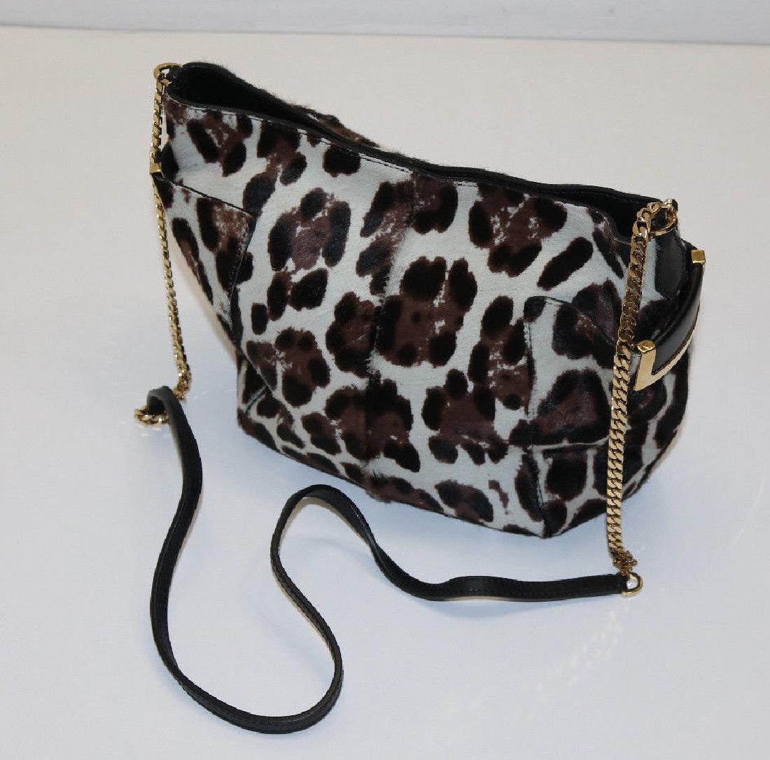 Jimmy Choo Anabel Crossbody Shoulder Bag: Jimmy Choo Anabel Leopard Print Crossbody Calf Hair Shoulder Bag Used Polished golden hardware and black leather trim Thin leather and chain shoulder strap; 21 1/2" drop. Open top with covered magneti