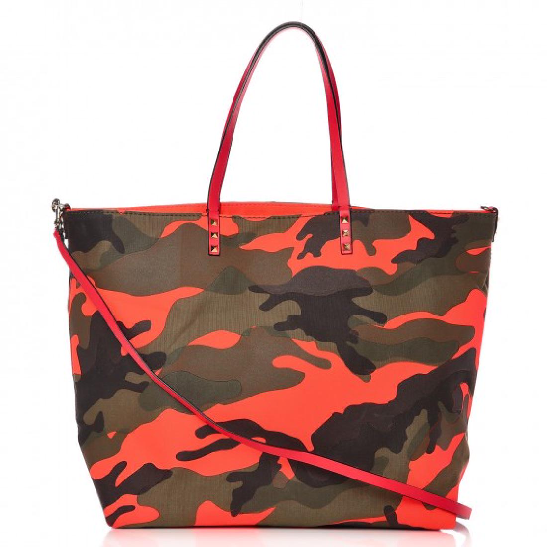 Valentino camouflage tote: Brand; Valentino Model: Camo tote Description: crafted of hot pink canvas on one side and textured green camouflage print on the other. The shoulder bag features pink leather shoulder straps and an op