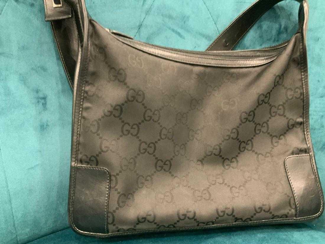 Gucci Mono Shoulder Bag: Brand: Gucci Model: Gucci black Mono shouldere Measurement: 12" long Condition: Gently Loved 9/10 Date/Serial code Available on Request 100% authenticity guaranteed
