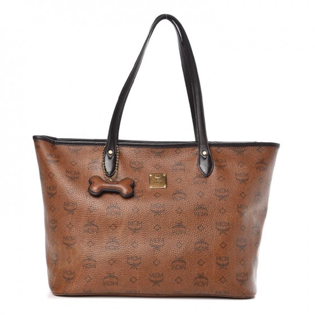 MCM bone shopper tote: Brand: MCM Model: Visetos shopper tote Description: crafted of visetos in brown with black MCM monogram print. The shoulder bag features black leather shoulder straps and polished brass hardware. The 