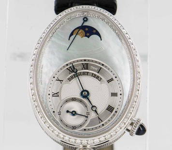 Breguet Reine de Naples Moonphase Watch: Brand - Breguet Series - Reine de Naples Model Number - 8908 Gender - Women's Movement - Automatic Calibre - 537 DRL1 Power Reserve (ex. 51 Hours) - 40 Case Size in MM - 36.50 x 28.45 mm Case Material