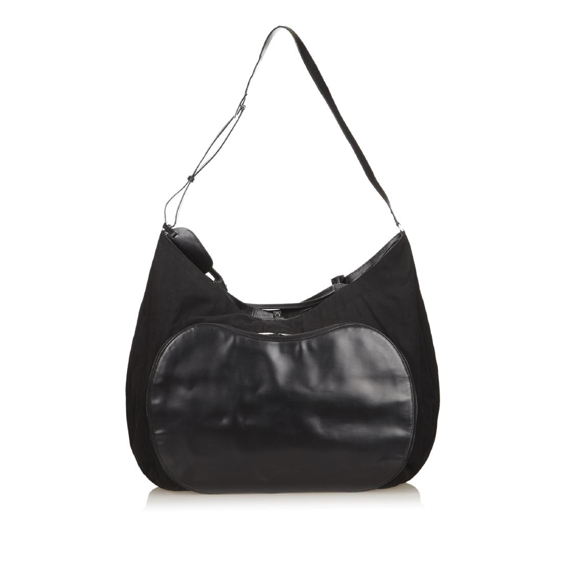 Gucci Black Fabric Extra Large Weekend Travel Bag: Brand:Gucci Style:Black Fabric Extra Large Weekend Travel Bag Description:Fabric and vinyl large travel bag with flat straps, and an adjustable shoulder strap, an exterior zip pocket, a top zip closur