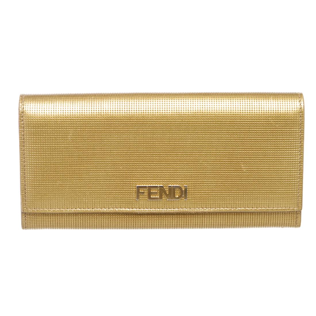Fendi Gold Leather Long Snap Wallet: Brand:Fendi Style:Gold Leather Long Snap Wallet Description:Fendi gold leather long wallet with leather and fabric lining, seven long pockets, ten card slots, snap closure Measurements:7.5"x1"x3.75"