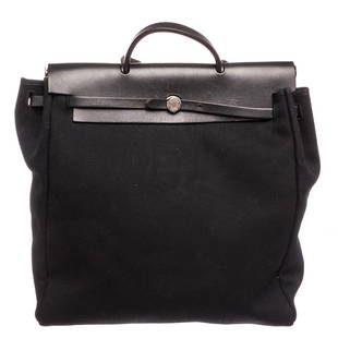 Hermes Black Canvas Leather Toile Herbag GM Bag: Brand:HermesStyle:Black Canvas Leather Toile Herbag GM BagDescription:Black Toile canvas HermÃ¨s Herbag GM with palladium-plated hardware, tonal Vache Hunter leather trim, single layered top