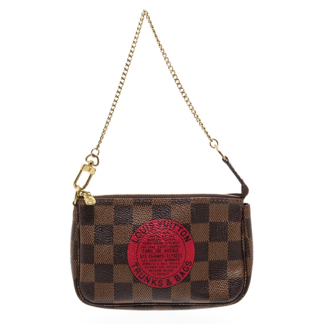 Louis Vuitton Damier Ebene Canvas Leather Trunks & Bags: Brand: Louis Vuitton Style: Damier Ebene Canvas Leather Trunks & Bags Mini Pochette Bag LTD Description: Brown Damier Ebene coated canvas Limited Edition Trunks & Bags Mini Pochette bag with dark brow