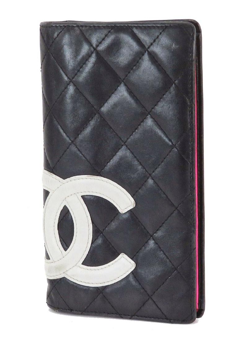 CHANEL Black Quilted Leather CC Long Wallet: Brand: Chanel Style: Black Quilted Leather CC Long Wallet Coin Purse Description: Black and White Quilted Leather CC Long Wallet Coin Purse, Two open pockets and bill slot with zippered coin purse bet