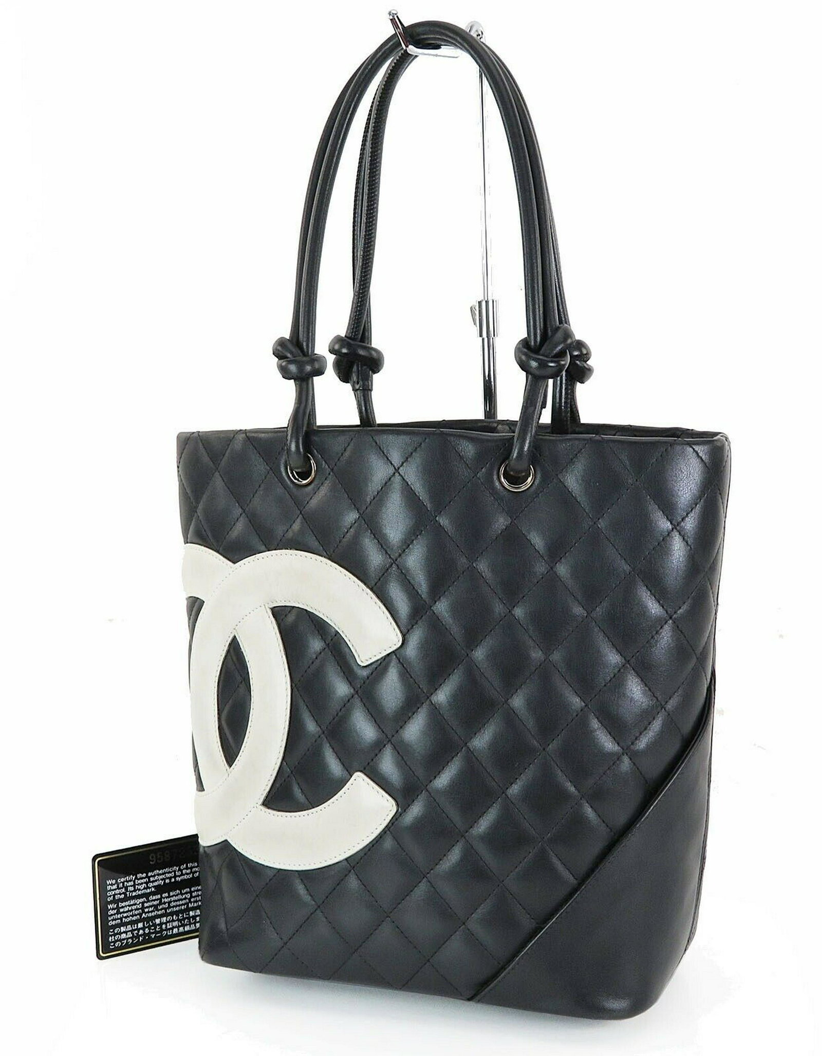CHANEL Leather Tote: Brand: Chanel Style: CHANEL Cambon Line CC Quilted Black and White Leather Tote Bag Description: CHANEL Cambon Line CC Quilted Black and White Leather Tote Bag. One outside open pocket. Two inside zip