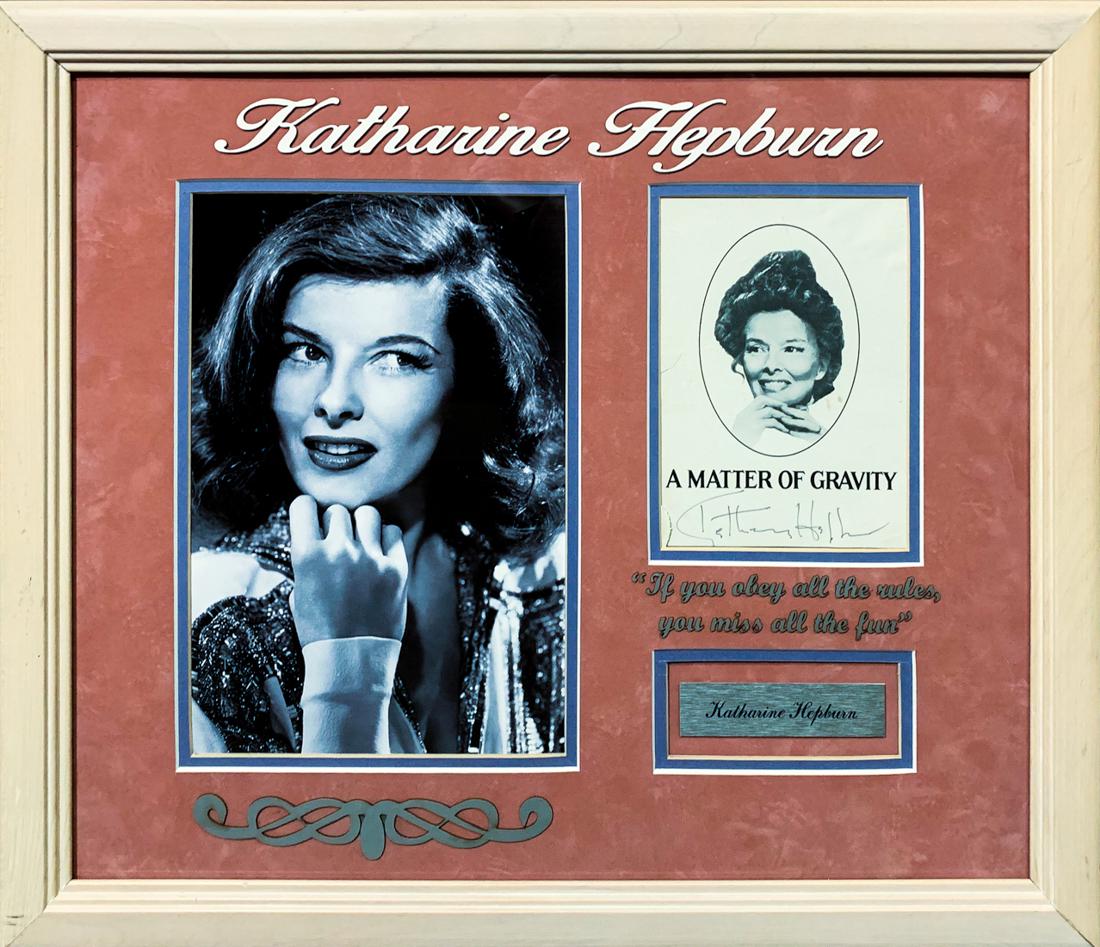 KATHRINE HEPBURN Signed "A Matter of Gravity" Book Page: Silver screen legend Katharine Hepburn (1907-2003) original signature on an advertisement from her play "A Matter of Gravity". Custom framed with a charming photo of Hepburn in a classic display with 