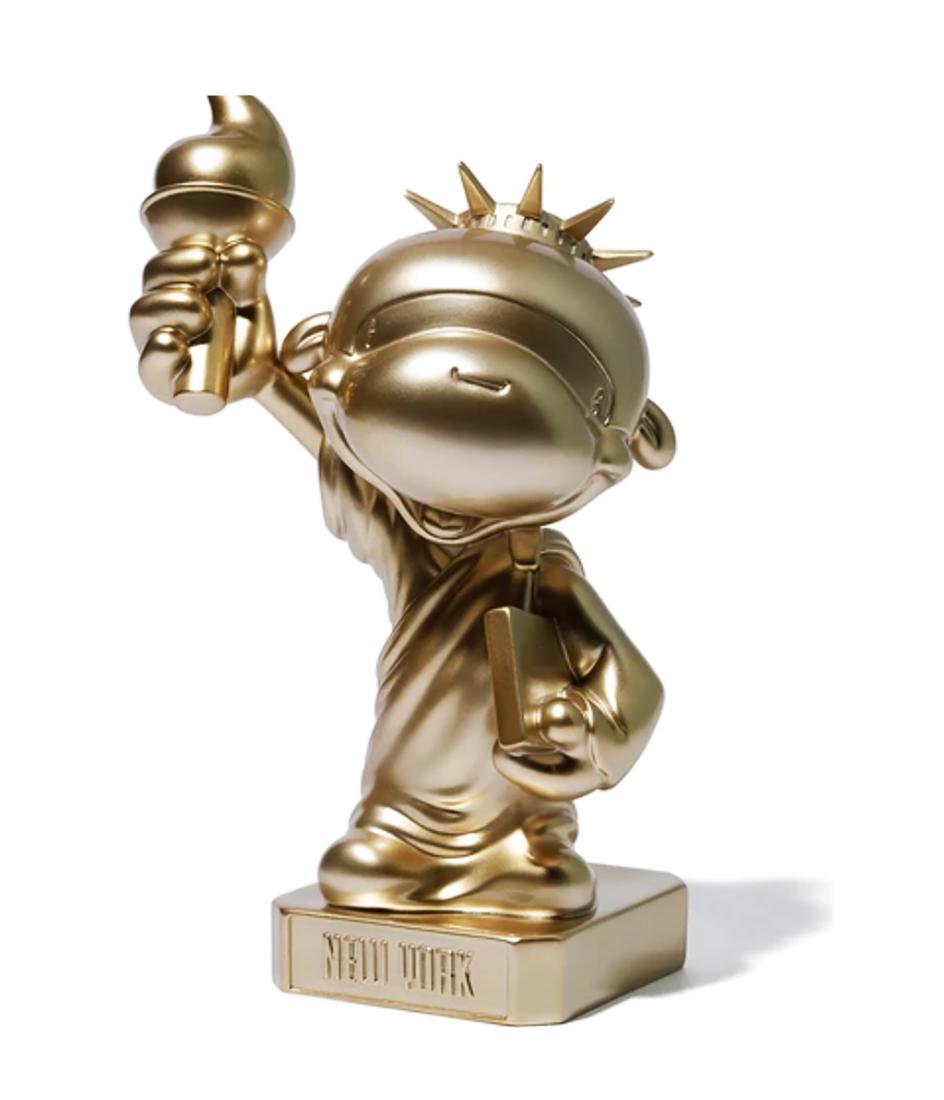 BAPE x Nowhere Co. 'Madison Ave. Baby Milo' Art Figure: 'Madison Ave. Baby Milo' by BAPE, 2019 Collab. with Nowhere Co, Ltd. Gold variant. 9 Inches (figure) 9 x 6.4 x 4.5 Inches (box) Collectible painted polystone art figure. Very Limited (unknown) Edition