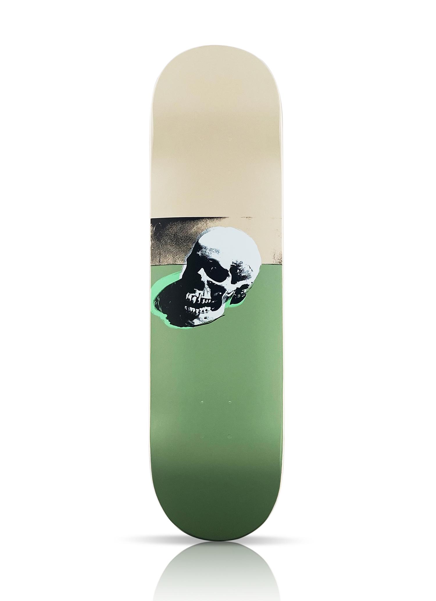 ANDY WARHOL 'Skull' Skateboard Deck: 'Skull' by Andy Warhol (after), 2020 Limited Edition Skateboard deck collab. with The Skateroom. Officially licensed by the Andy Warhol Foundation. White variant (on green and cream deck). 8 x 31 Inch