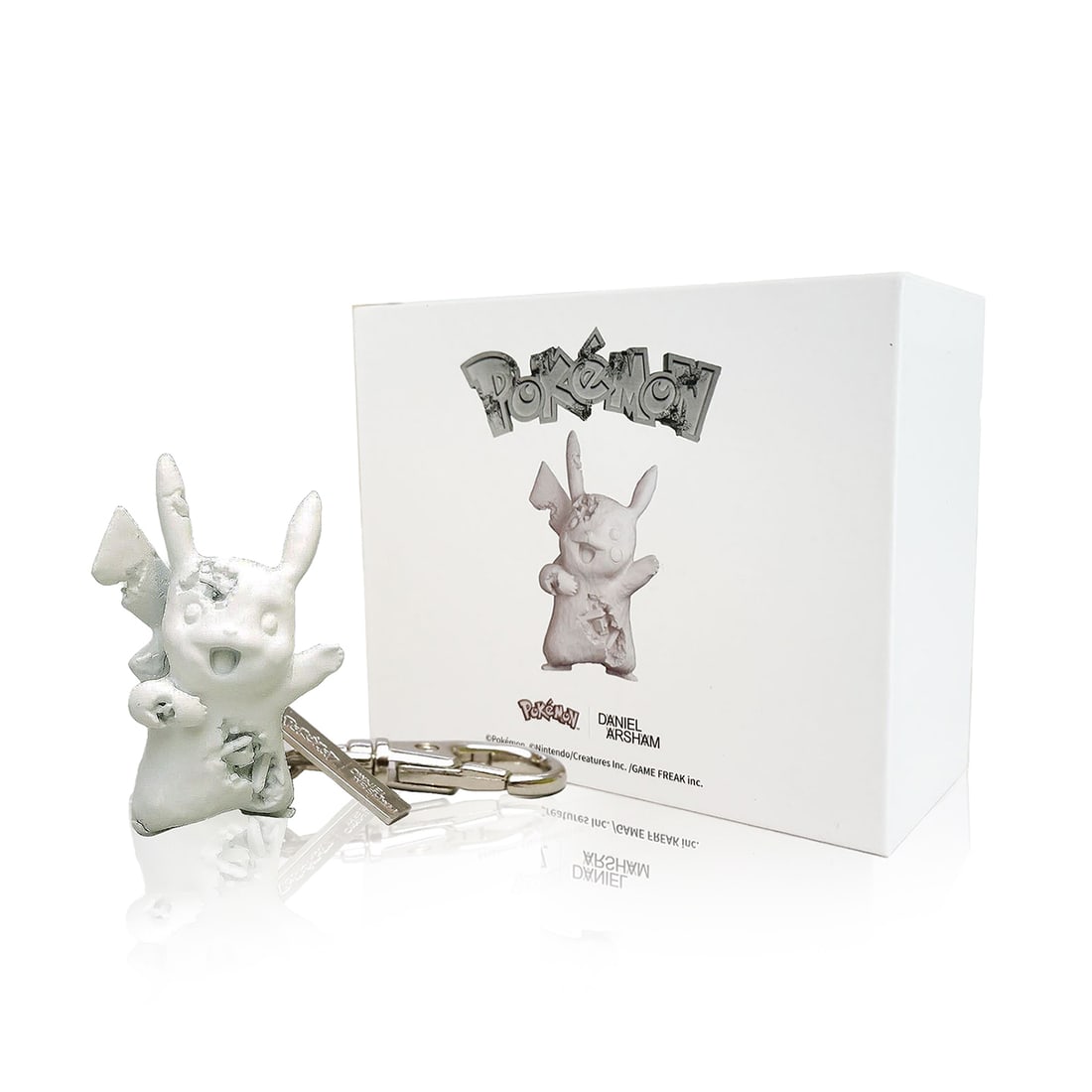 DANIEL ARSHAM x Pokemon 'Pikachu' (2022) Crystallized Eroded Keychain: 'Pikachu' by Daniel Arsham, 2022 Limited Edition collab. with Pokemon x Nanzuka. Introduced at the artist's 'A Ripple in Time' show, Tokyo, Japan. 3 x 2.25 x 1.5 Inches 7.6 x 5.7 x 3.8 Centimeters 4.4