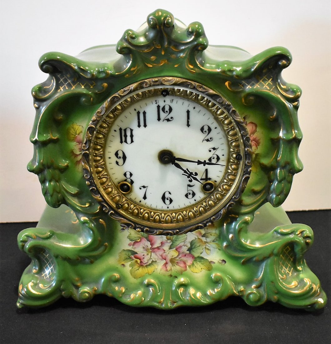 Ansonia "Whisper" Porcelain Clock: Ansonia "Whisper" Porcelain Mantle Clock. Measures 10.5" x 11"