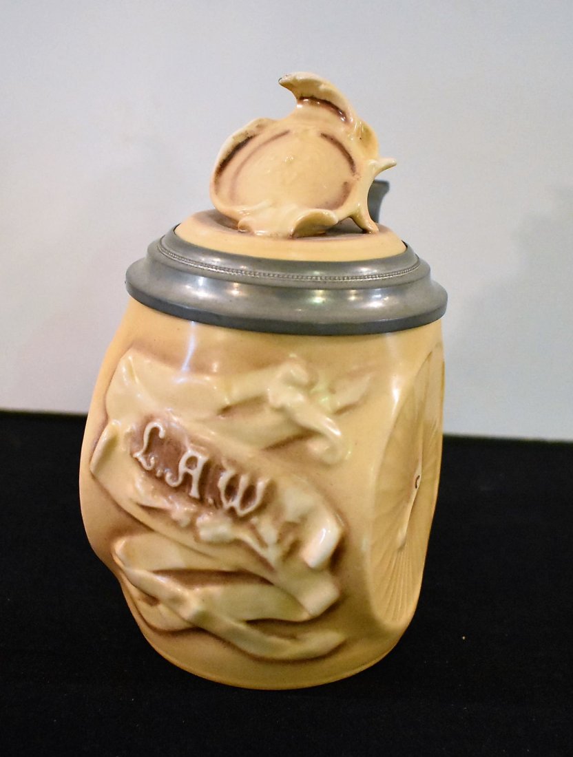 Schierholz LAW Bicycle Character Beer Stein: Schierholz L.A.W. High Wheeler Bicycle 1/2 liter Porcelain Character Beer Stein, marked Musterschutz with desirable High Wheeler Bicycle Crashing Lithopane. c1900