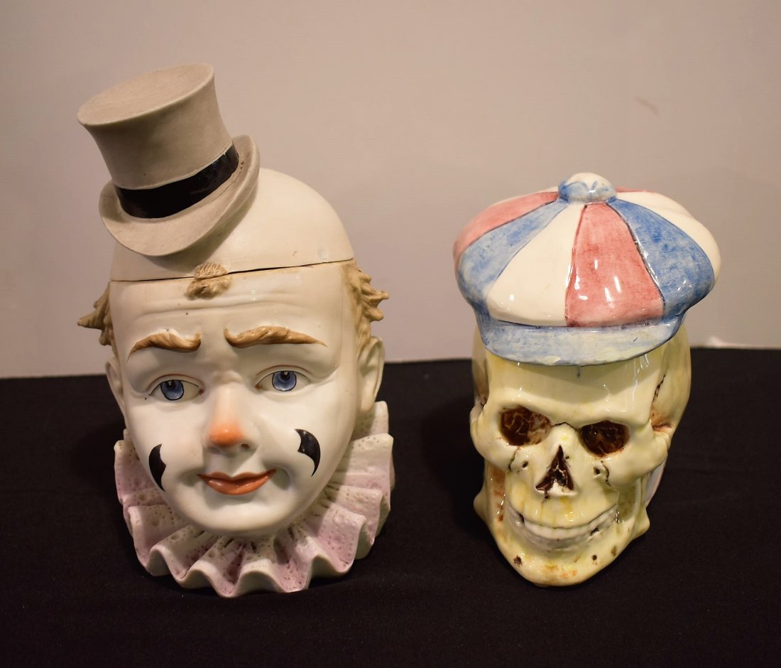 2 Vintage Lidded Tobacco Jars Skull & Clown: Group of 2 Vintage Lidded Tobacco Jars including: 1900's Porcelain Skull marked on the bottom, 5" tallPorcelain Clown 7"