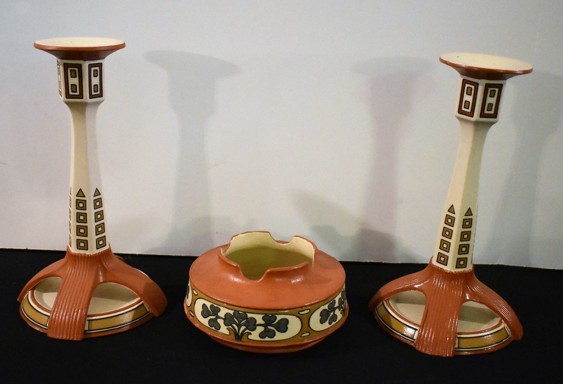 Mettlach Art Nouveau Candle Sticks & Ashtray: Mettlach Art Nouveau Candle Sticks 3389 and Ashtray 2840. Candle Sticks measure 8.25" and the Ashtray measures 5" in diameter.
