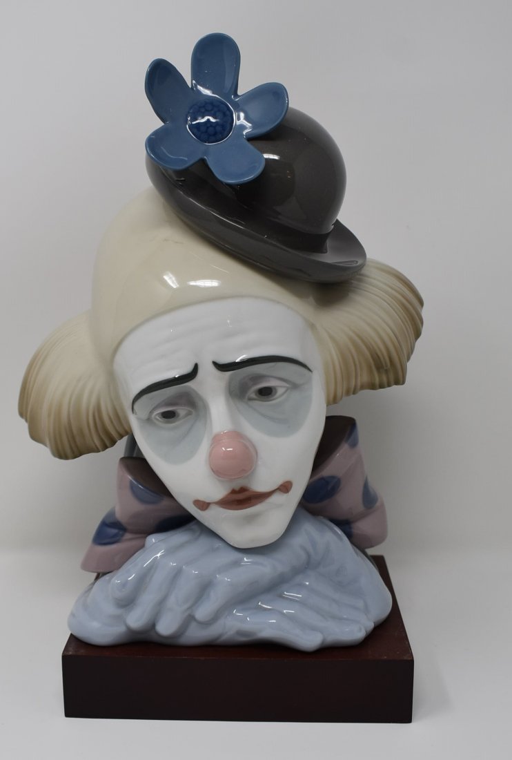 Lladro 5130 Pensive Clown: Lladro #5130 "Pensive Clown", measures 10.5" tall, has wood base, in original box.