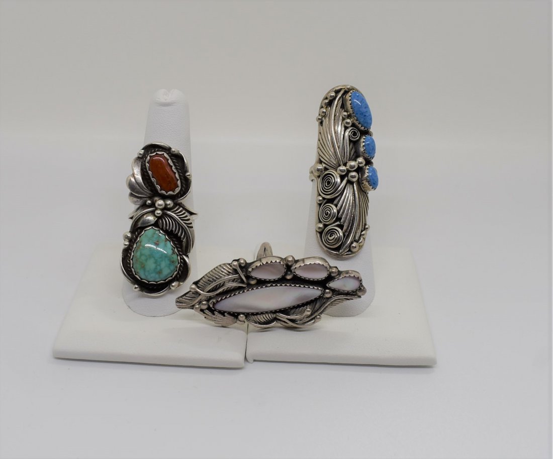 Group of 3 Sterling & Turquoise Rings Signed: A Lot of 3 Large Turquoise, Coral and Mother of Pearl & Sterling Silver Rings, sizes range from 6 to 8.