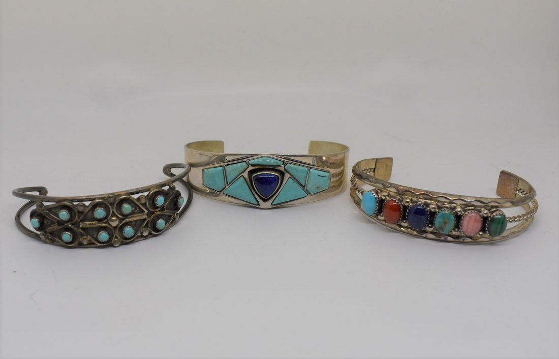 Group of 3 Sterling Silver & Turquoise Cuff Bracelets: A Lot of 3 Sterling Silver with Turquoise and Other Stones Cuff Bracelets including Desert Rose Trading.