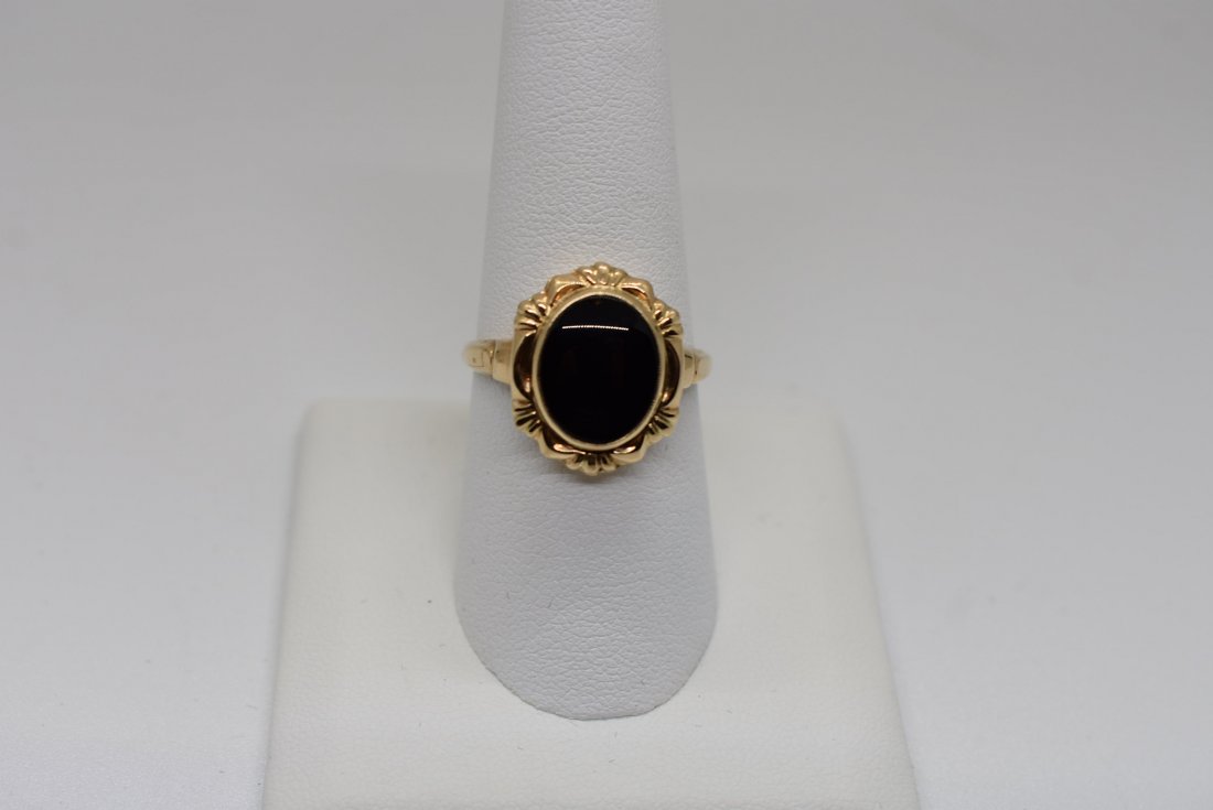 10K Gold and Onyx Ring: 10K Yellow Gold and Onxy Ring, size 8.5. Very attractive and comfortable ring.
