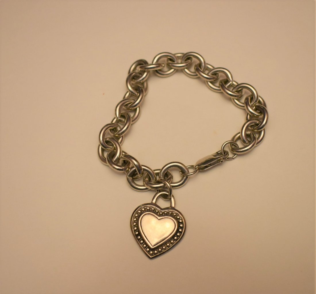 Heavy Judith Ripka Sterling Silver Charm Bracelet: Heavy Judith Ripka Signed Charm Bracelet. It measures 7.25" long.