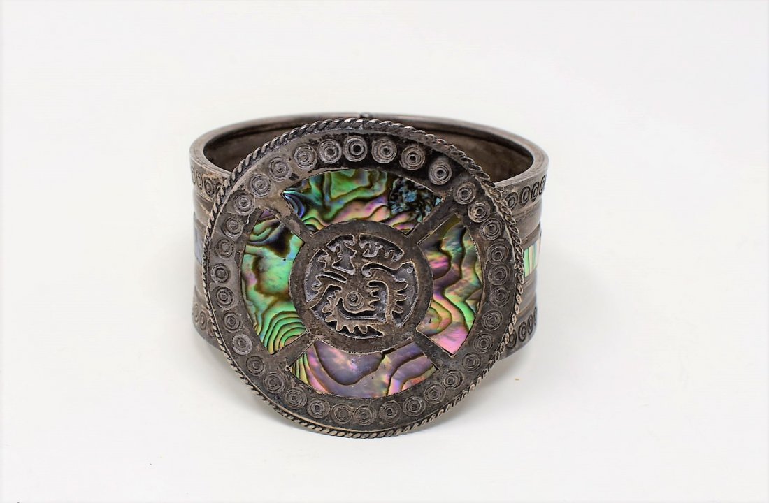 Large Taxco Sterling Silver and Abalone Bracelet: Large Taxco Sterling Silver and Abalone Bracelet, center piece measures 2" in diameter.