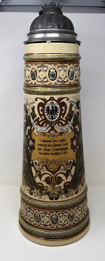 Mettlach 1161 Beer Stein 7 Liter: Mettlach 7 Liter 1161 Beer Stein. This is the largest stein made by Mettlach. Fantastic pewter lid with eagle thumblift and German 1913 German Duetche Mark inserted in crown. Measures 22" tall. Fantas