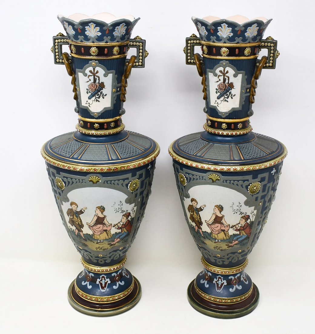 Pair of Mettlach Vases 2301: A pair of Mettalch Vases measuring 15.5" tall, featuring children playing and dancing.