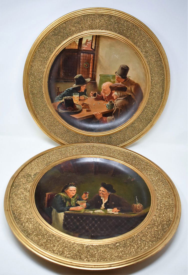 Pair of Gesetzlich Geschutz Plaques German Scenes: A Pair of Hand Painted Gesetzlich Geschutz Plaques with German Scenes, measure 18.5" in diameter.