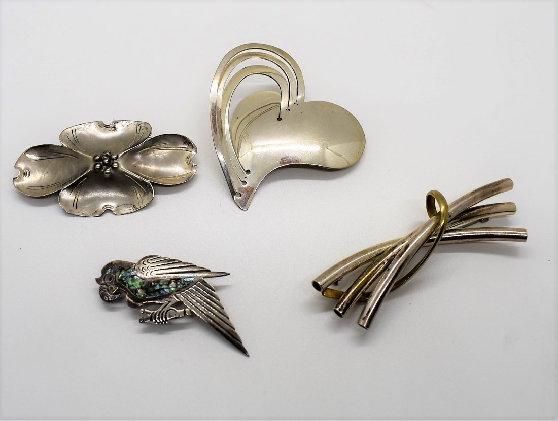 Lot of 4 Sterling Silver Brooches Pins: A Group of 4 Sterling Silver Brooches, all are marked.