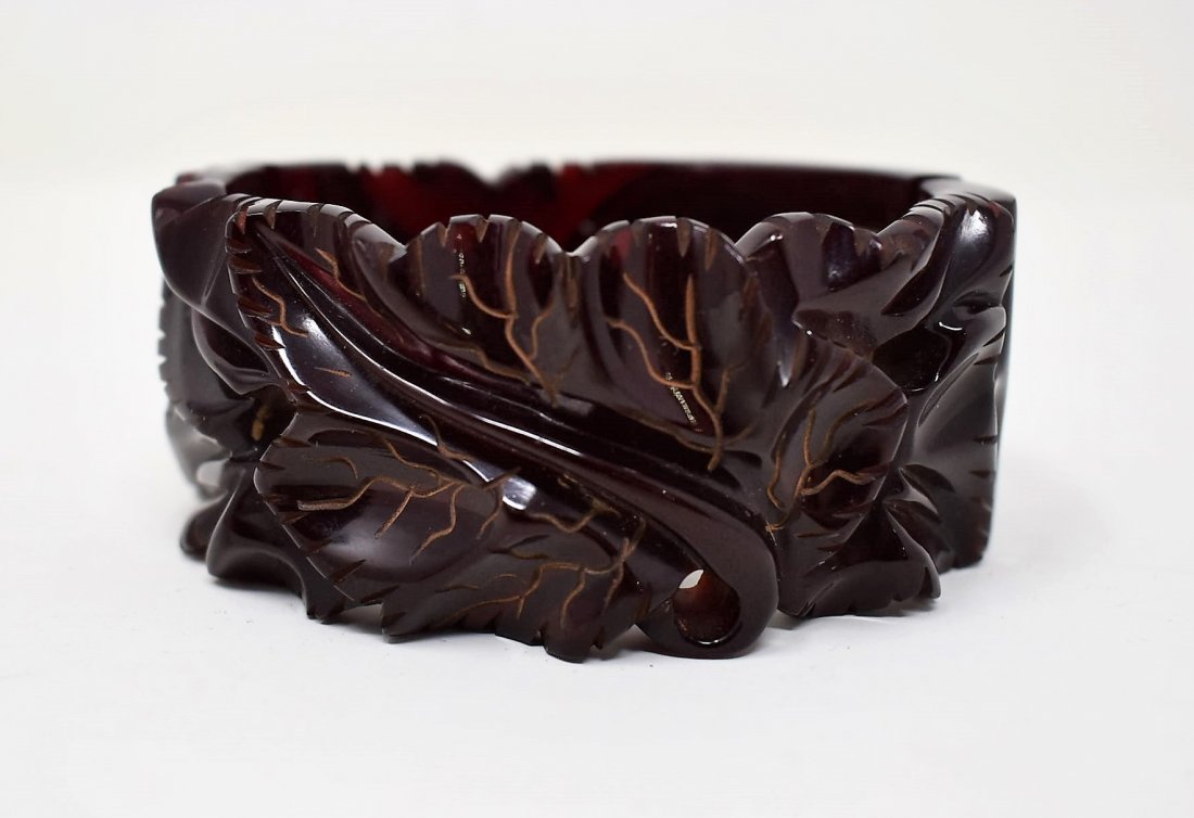 Bakelite heavily Carved Red Wine Hinged Cuff Bracelet: Here is a Rare and amazing Example of Heavy Carved Blood Red/Red Wine Bakelite Cuff Bracelet with Leaf Design and Gold Accents - in amazing shape except for 2 missing pins that hold the hinge onto the