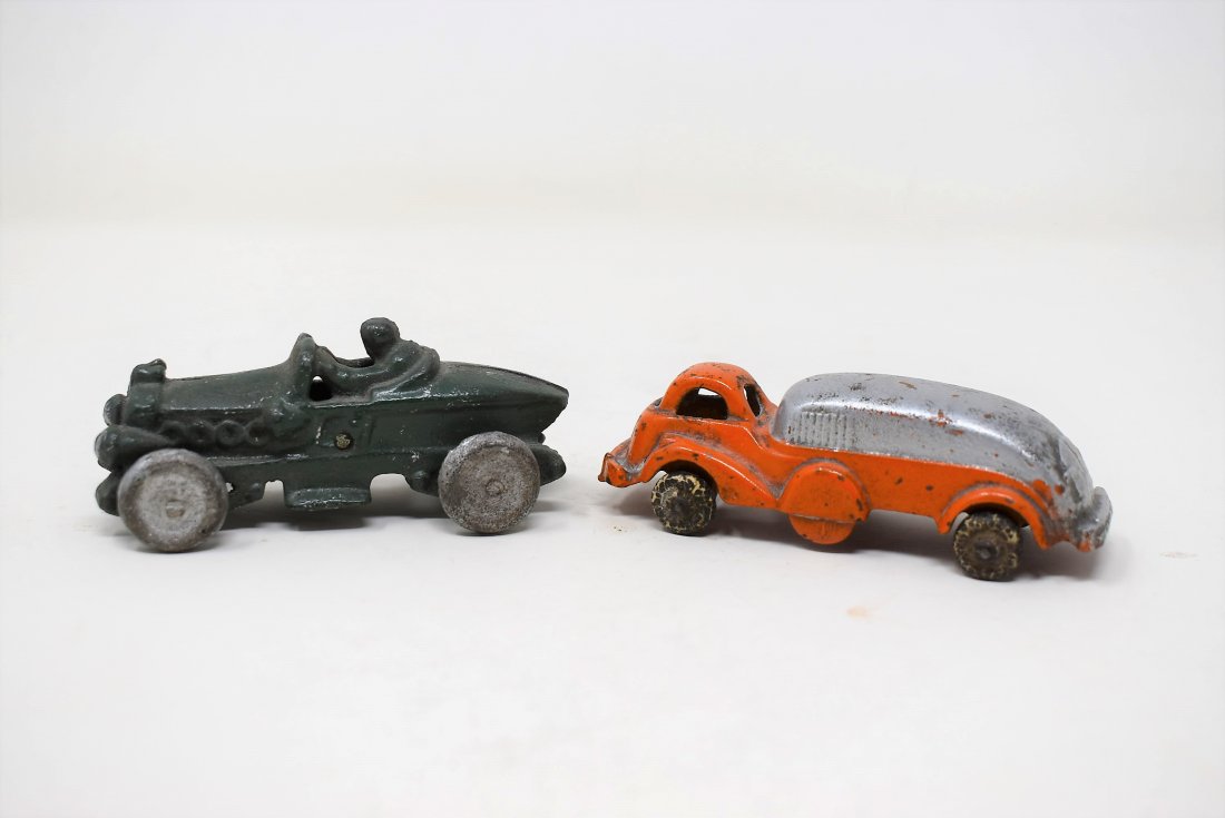 Pair of Arcade or Hubley Cast Iron Cars Race Car Truck: we believe the following is a Pair of Arcade or Hubley Cast Iron Cars - Race Car & Garbage Truck (?) - As shown condition, please see the Photos they are aprox 4" long each