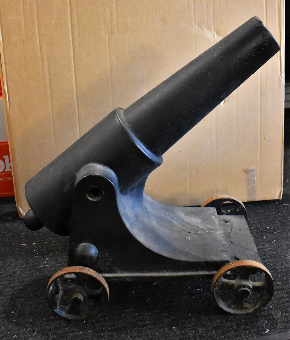 Large Cast Iron Canon: Cast Iron Cannon on Wheels, measures 21" tall x 17" long. Does not fire