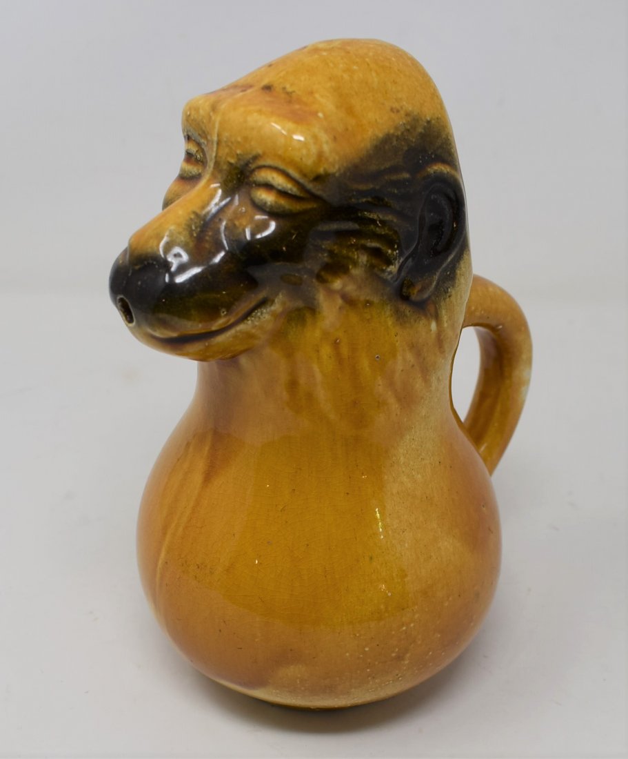 Majolica Pottery Monkey Pitcher Old Sarreguemines: A 19th century French Barbotine faïence, stylized monkey jug produced by Sarreguemines, “Le Singe” mold no. 3312. A grotesque representation of the monkey likely used for water in the ritual of d