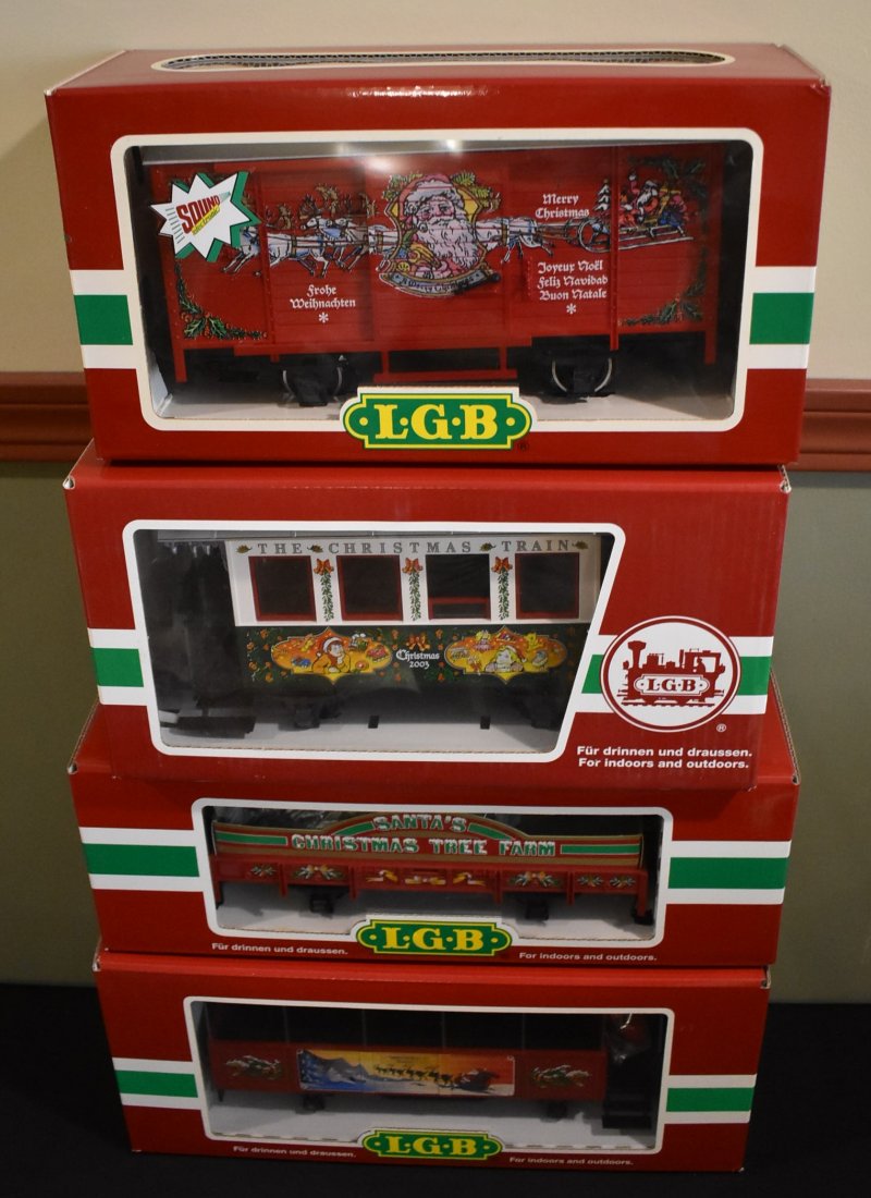 Lot of 4 LGB G Scale Christmas Cars: A Lot of 4 LGB G Scale Christmas Cars including 4335s, 37076, 42103 and 32250, in original boxes. May have been displayed.