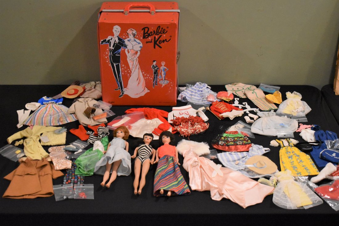 1963 Barbie Case W/ 3 Dolls and Clothes: 1963 Barbie Case W/ 3 Dolls and Clothes. Dolls are: 1961 Barbie Bubble Cut Red Hair w/ Blue Striped Dress, 1963 Barbie Brunette Bubble Cut W/ Orange Top and Striped Skirt and 1961 #5 Ponytail Brunette