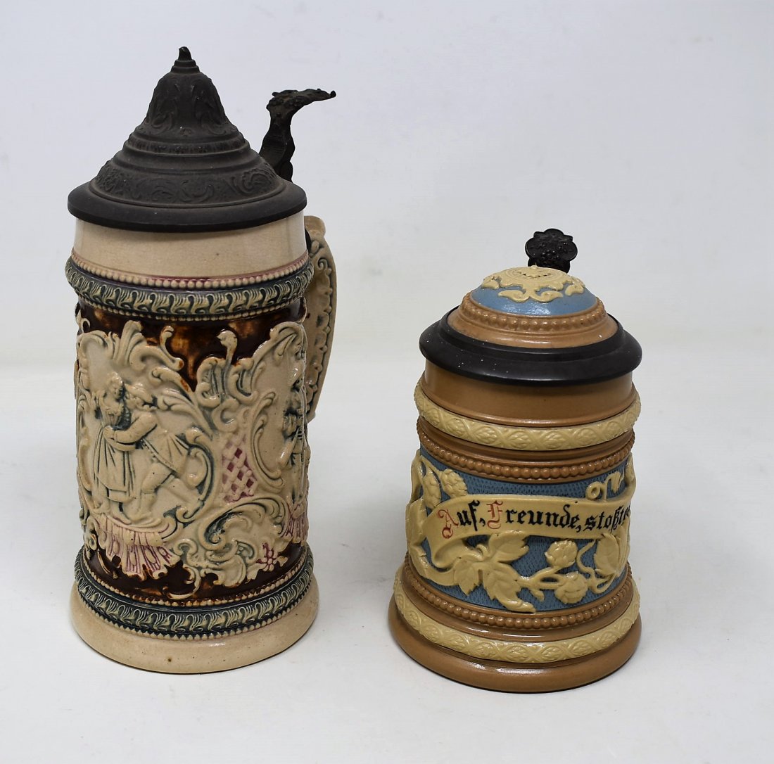 pair of steins Mettlach 1740 &1/2 liter pottery couple: 1/4 liter Mettlach #1740 relief mint- browning to interior1/2 liter pottery loving scene - mint