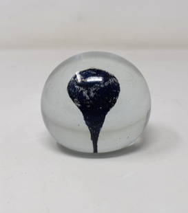 Early Charles Lotton 1972 Paperweight: Unusual very early Charles Lotton paperweight. Clear with blue interior piece. It appears to be an experimental piece and measures 2.5" in diameter.