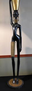 Life Size Brass African Woman Sculpture Gatco: 5' Tall Life Size Brass African Woman Sculpture. Made by Gatco company, still has the decal attached. Definitely a statement piece.