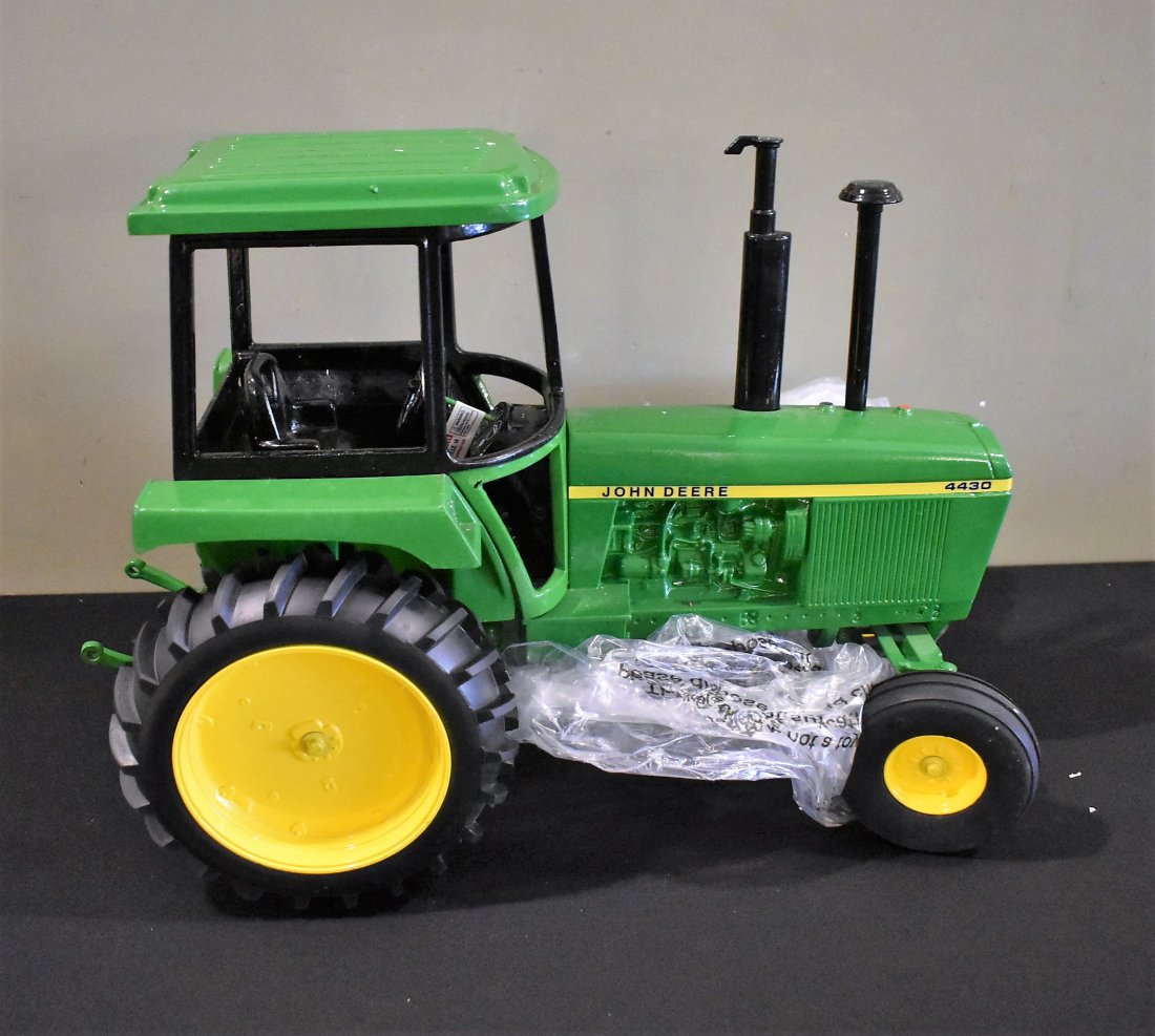Big 1/8 Scale John Deere Die-Cast 4430 Tractor NEW: Scale Models BIG 1/8 Scale Die-Cast John Deer Tractor 4430, new in original box with shipping box. This is a large, heavy item