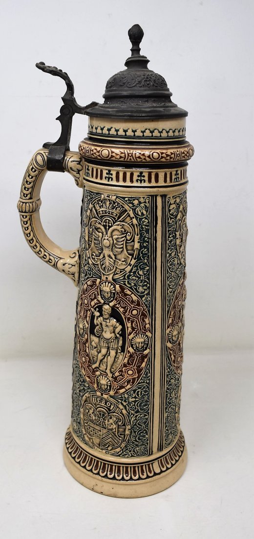 Tall 2 liter Pottery Beer Stein: Pottery Beer Stein with Pewter Lid, measures 14" tallexcellent color wrap around decoration, double eagle, shield at base, and athlete? Father Jahn?lid shows slight dent otherwise mint