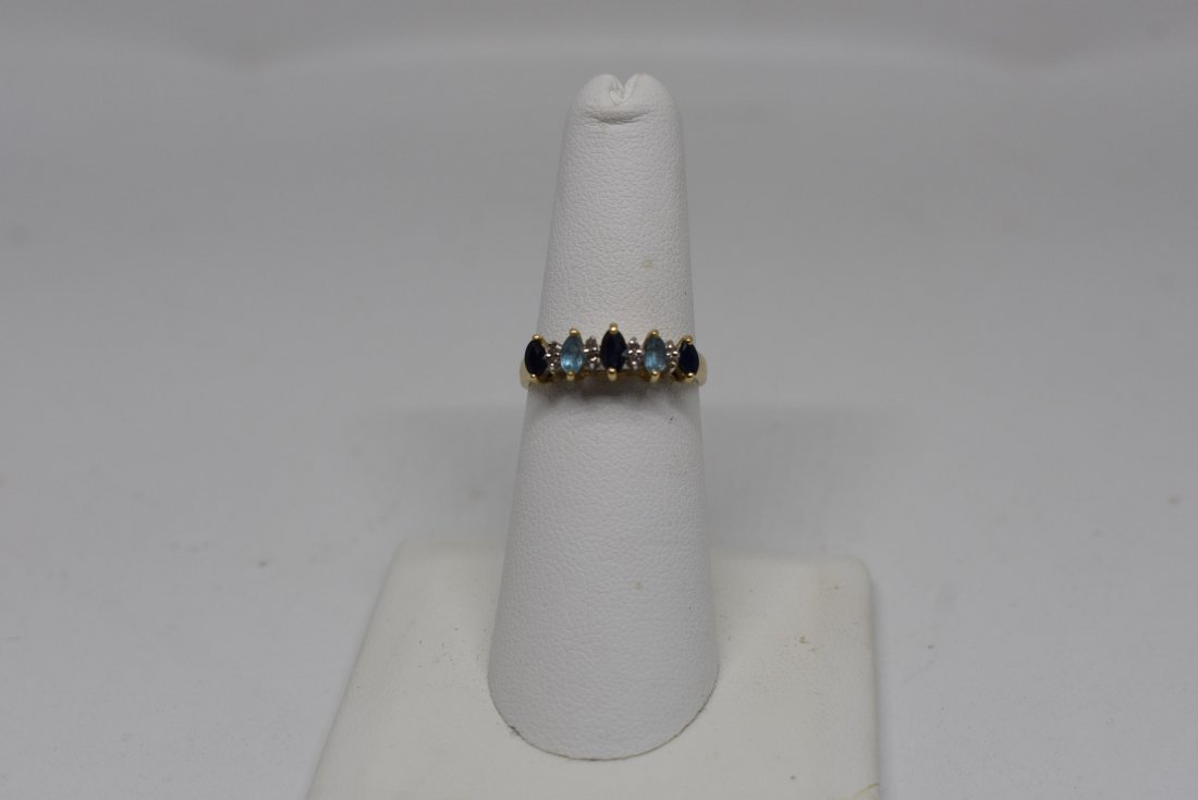 14K Yellow Gold Ring w Sapphires & Blue Topaz: 14K Yellow Gold Ring with 3 Sapphires and 2 Blue Topaz. 2.3g, size 5.75